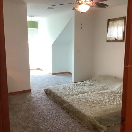 a view of room with wooden floor