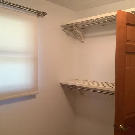 a kitchen with granite countertop a sink and cabinets