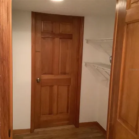 a kitchen with a sink cabinets and window