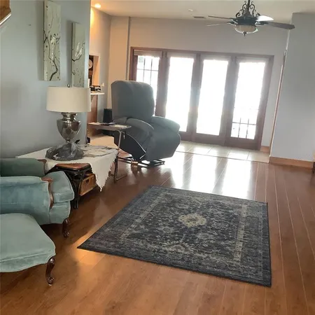 a bathroom with a granite countertop shower and a sink