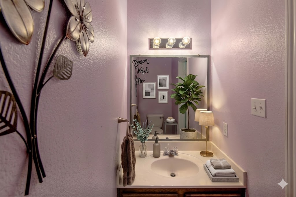 508 Emma Rose Trail Leander, TX 78641 - Photo 14 of 40 A neatly arranged powder room featuring a single vanity and illuminated by modern lighting.