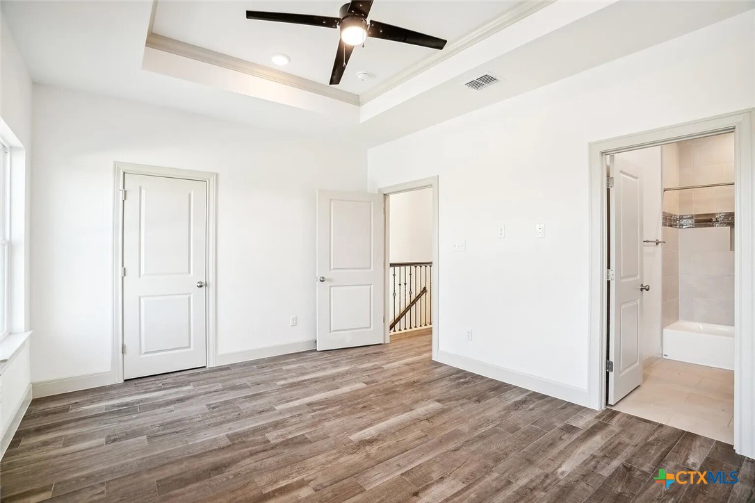289 Star Grass, Unit 3 Spring Branch, TX 78070 - Photo 20 of 40 a view of empty room with wooden floor
