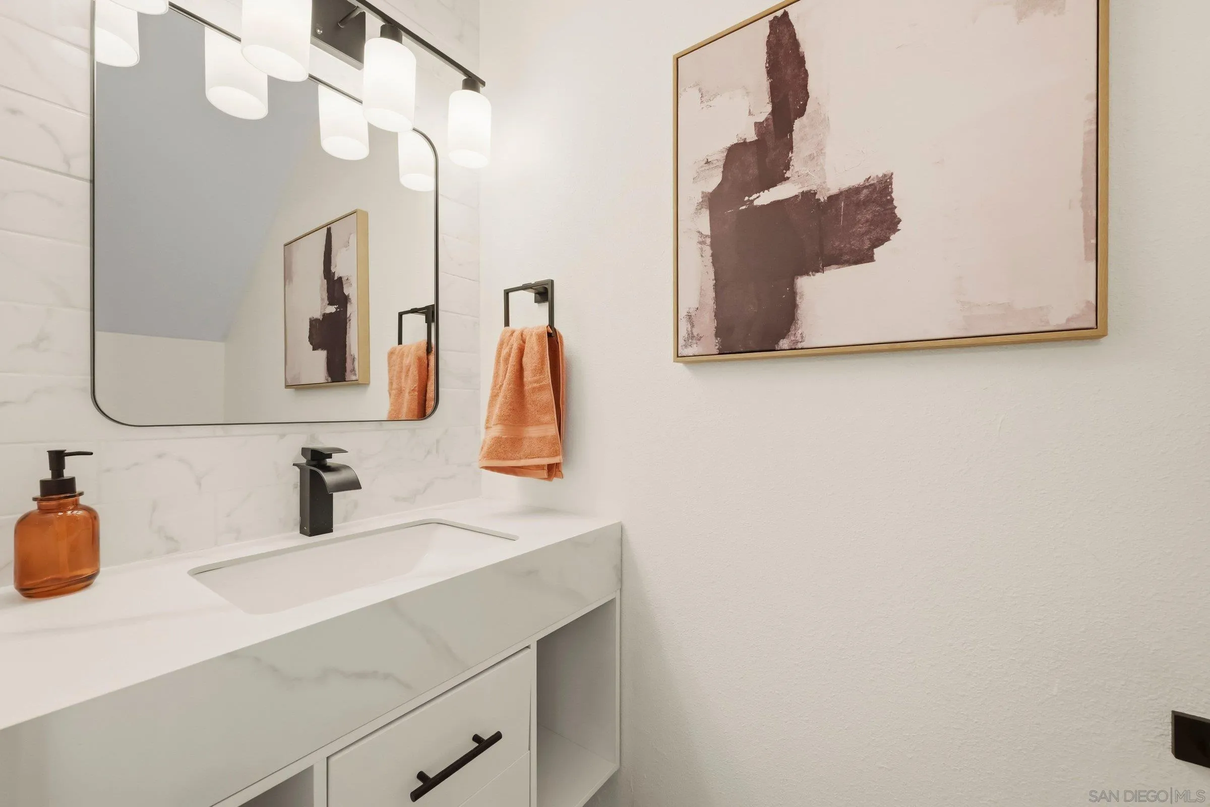 458 Ridgeway Court Spring Valley, CA 91977 - Photo 22 of 26 a bathroom with a sink and a mirror