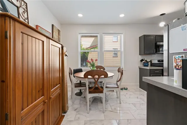 a dining room with furniture and window