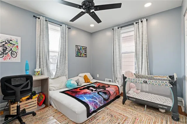 a bedroom with furniture and windows