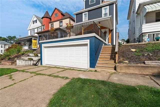 front view of a house with a street