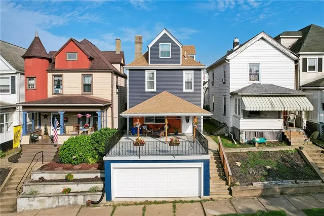 an aerial view of multiple houses with outdoor space