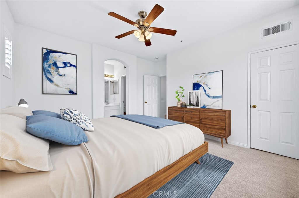 447 Ridgeway Irvine, CA 92620 - Photo 42 of 88 a bedroom with a bed and ceiling fan