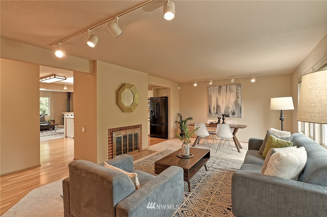337 View Ridge Drive Everett, WA 98203 - Photo 4 of 38 a living room with fireplace furniture and a wooden floor