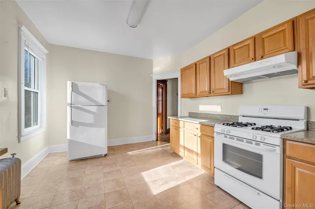 a kitchen with a stove oven and cabinets