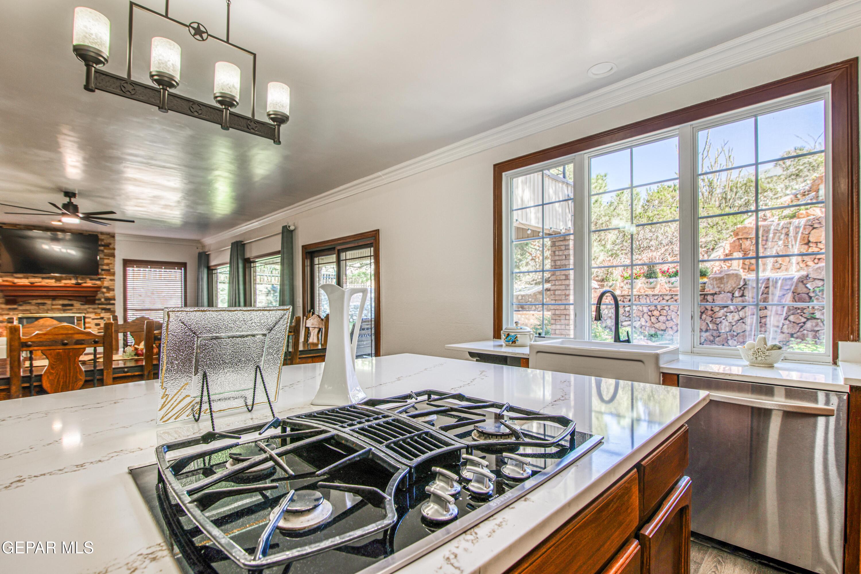 6620 Imperial Ridge Drive El Paso, TX 79912 - Photo 15 of 50 a kitchen with stainless steel appliances granite countertop a stove and a refrigerator