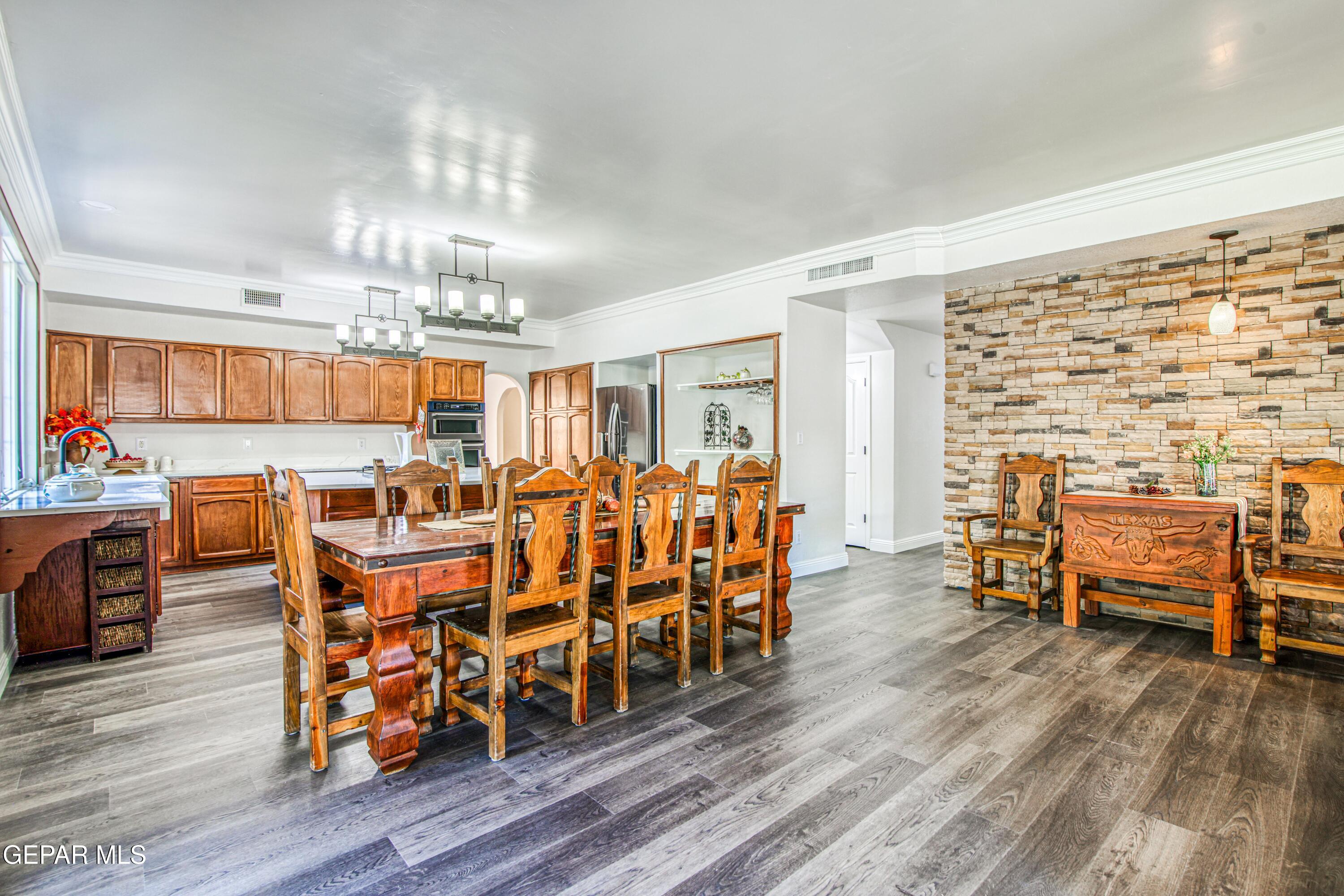 6620 Imperial Ridge Drive El Paso, TX 79912 - Photo 20 of 50 a view of a dining room with furniture and wooden floor