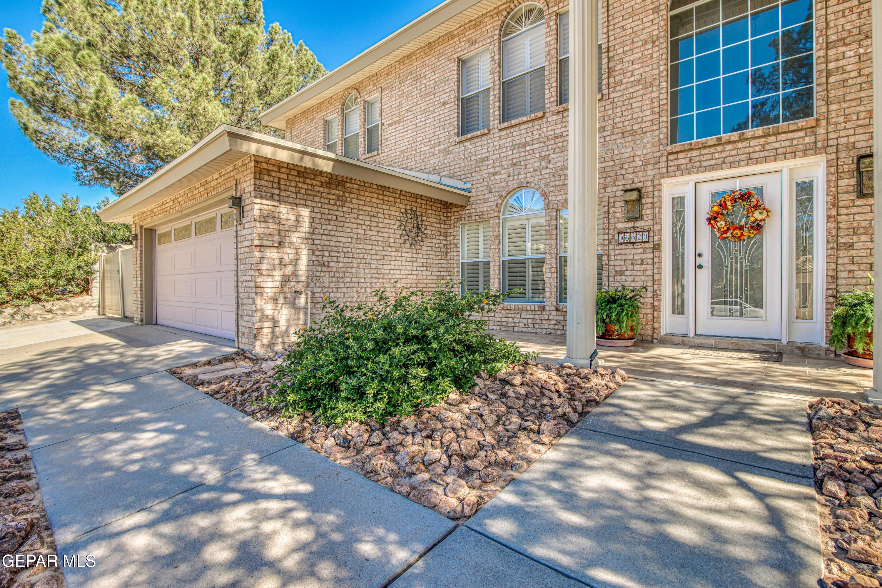 6620 Imperial Ridge Drive El Paso, TX 79912 - Photo 2 of 50 a view of a house with a yard