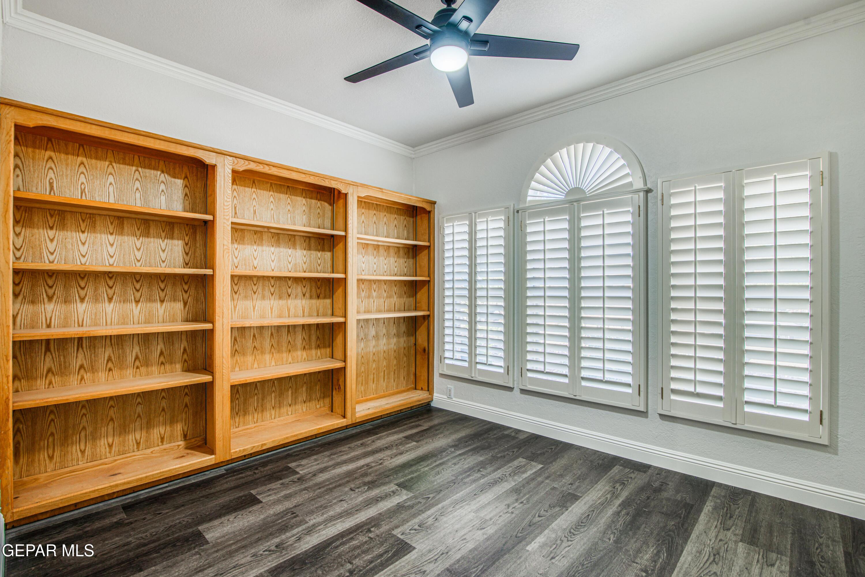 6620 Imperial Ridge Drive El Paso, TX 79912 - Photo 22 of 50 a view of empty room with wooden floor and fan