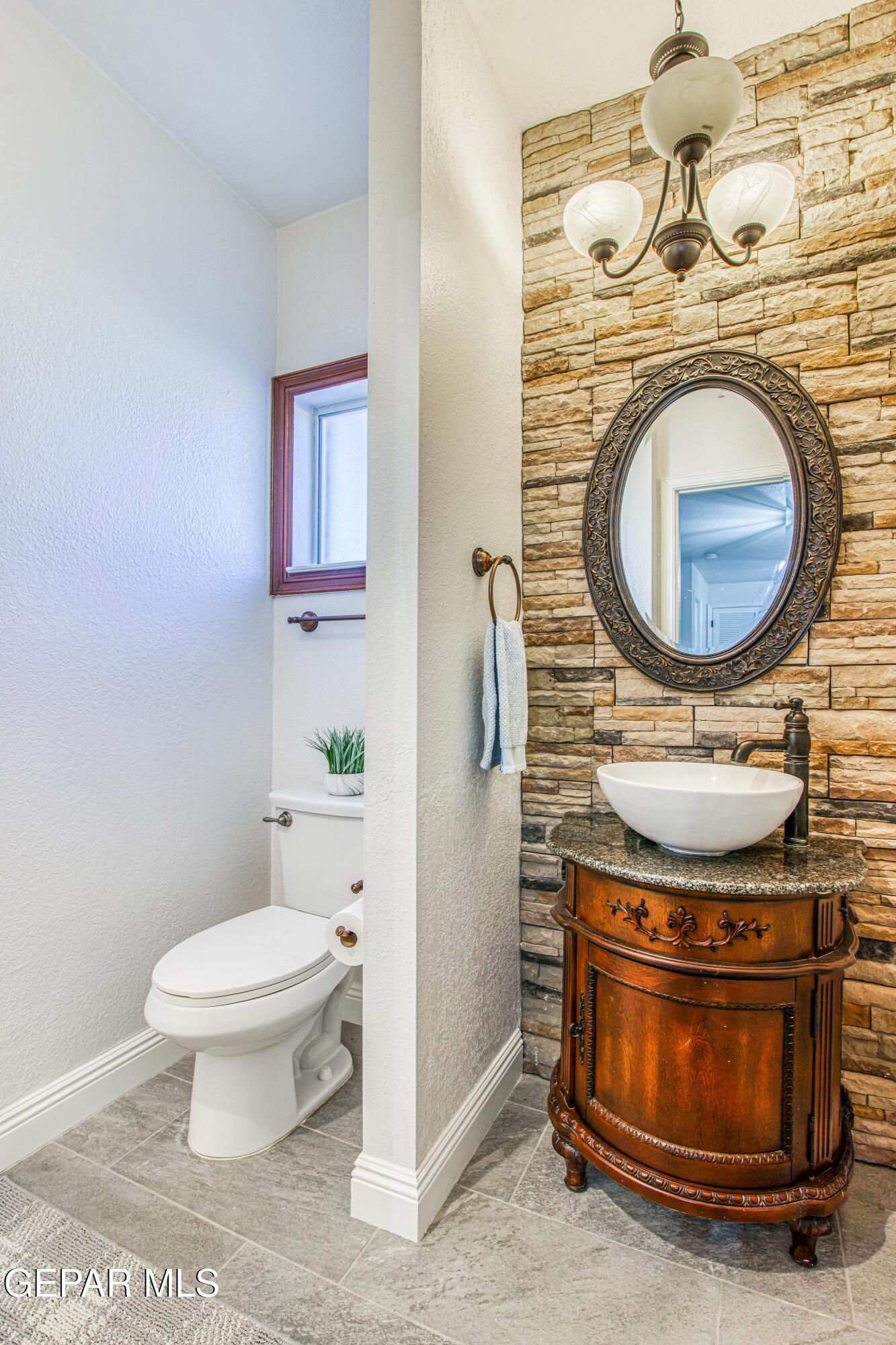 6620 Imperial Ridge Drive El Paso, TX 79912 - Photo 23 of 50 a bathroom with a stove and a sink