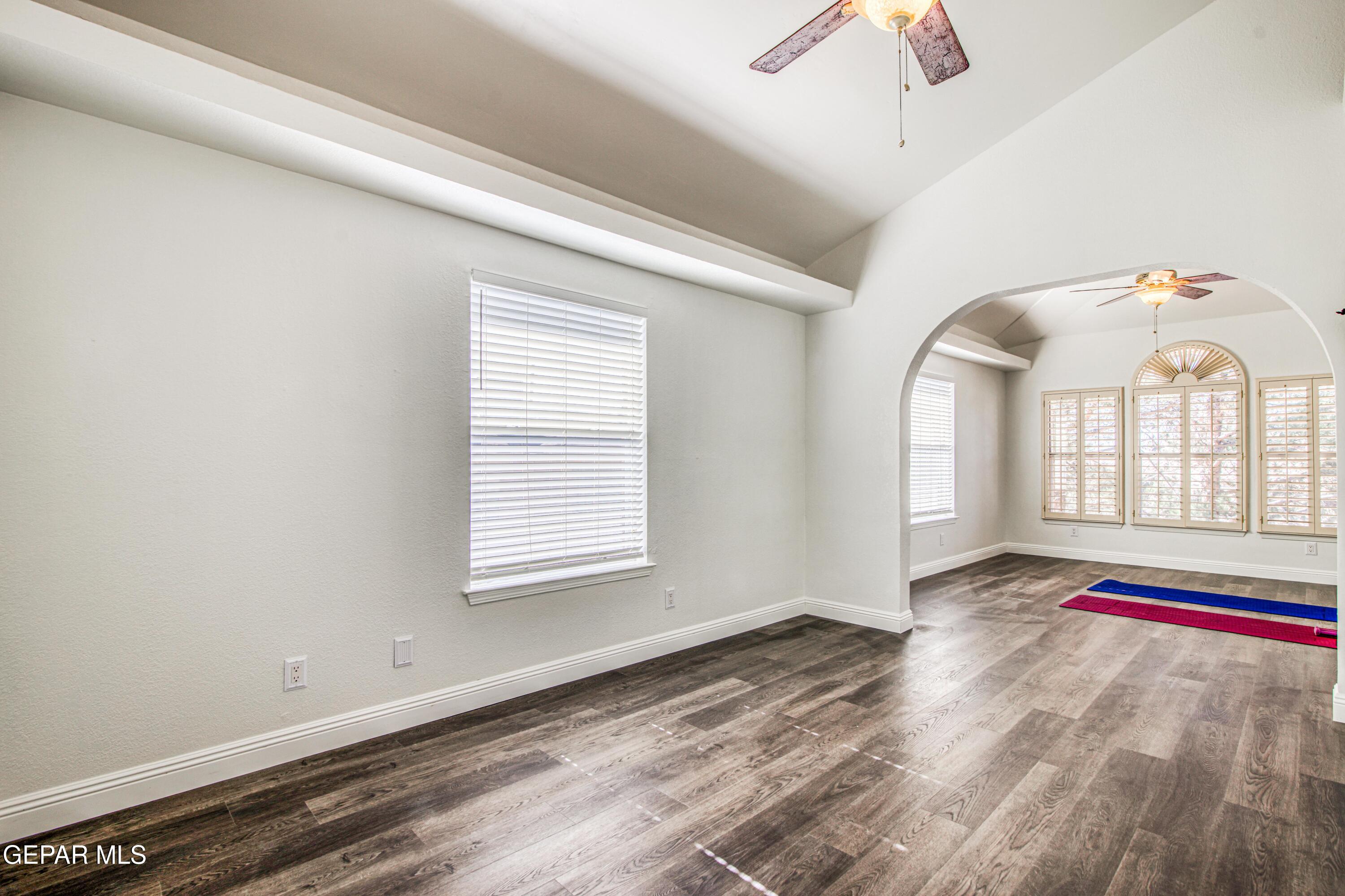 6620 Imperial Ridge Drive El Paso, TX 79912 - Photo 26 of 50 wooden floor in an empty room with a window