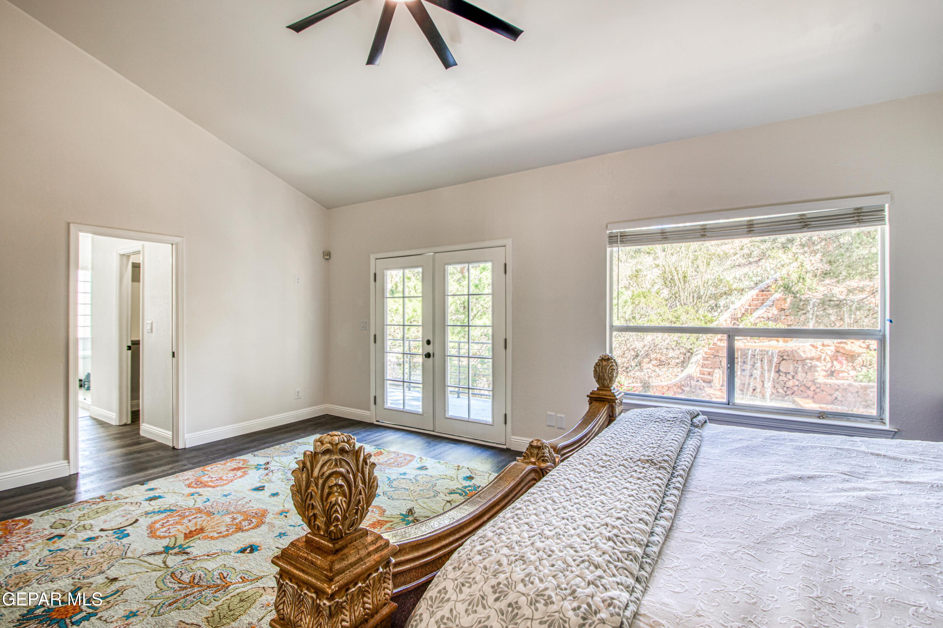 6620 Imperial Ridge Drive El Paso, TX 79912 - Photo 29 of 50 a bedroom with a bed and wooden floor