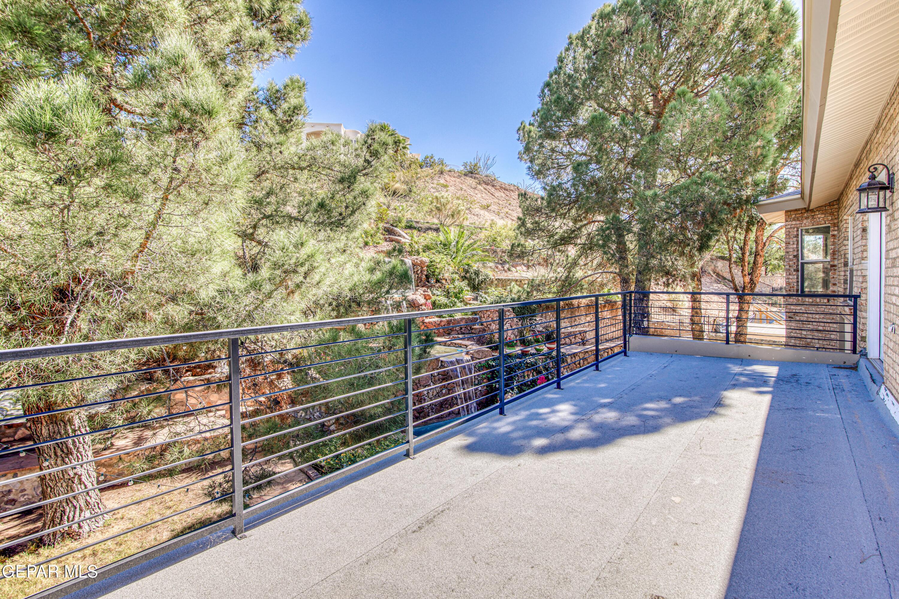 6620 Imperial Ridge Drive El Paso, TX 79912 - Photo 33 of 50 a view of a balcony with wooden floor and fence