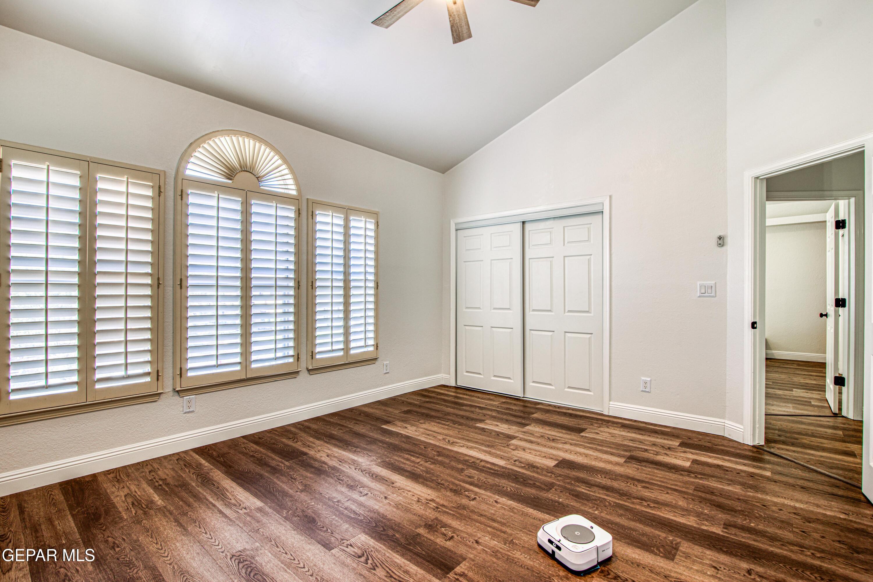 6620 Imperial Ridge Drive El Paso, TX 79912 - Photo 37 of 50 a view of empty room with wooden floor and fan