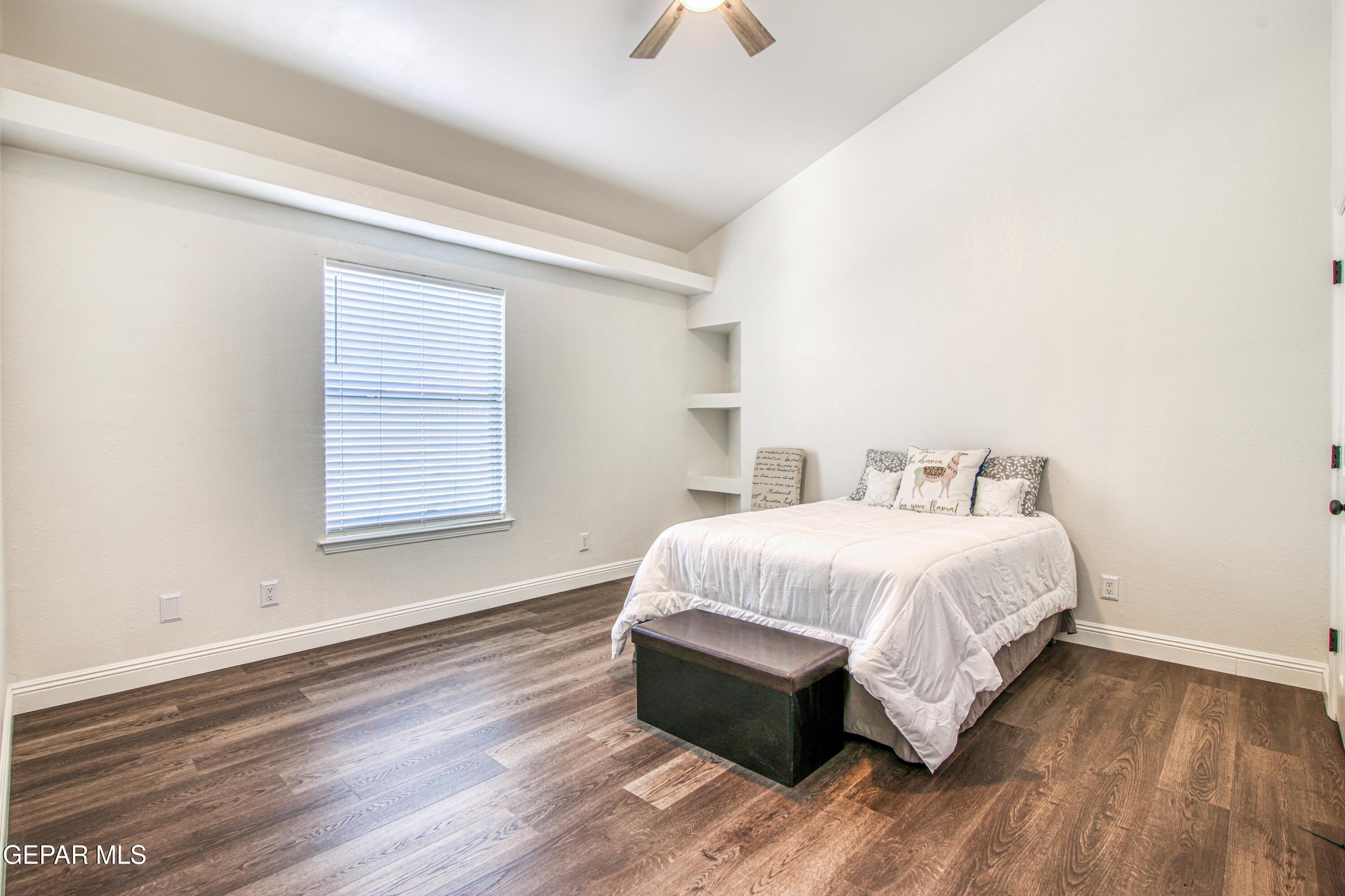 6620 Imperial Ridge Drive El Paso, TX 79912 - Photo 38 of 50 a bedroom with a bed and a window