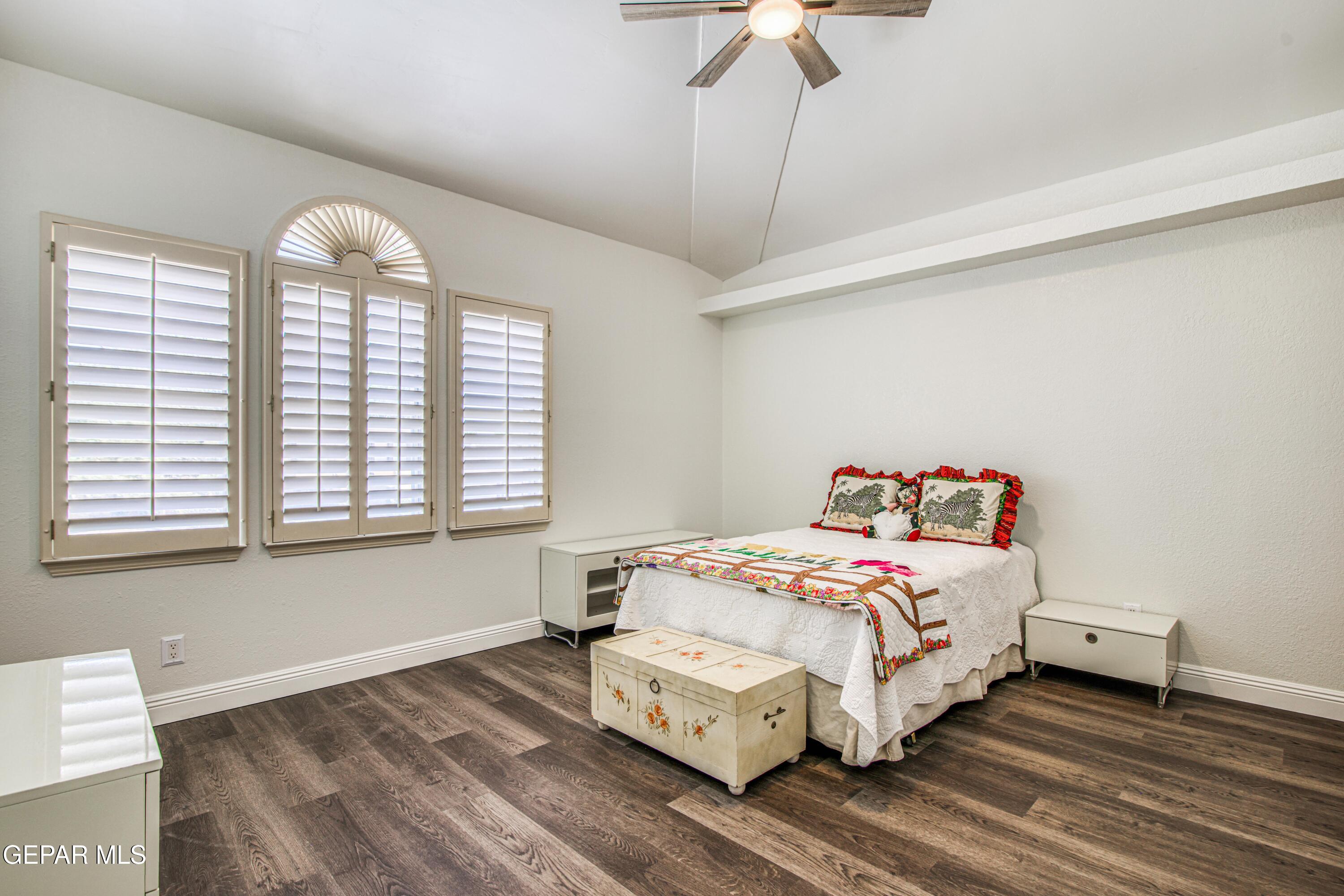 6620 Imperial Ridge Drive El Paso, TX 79912 - Photo 39 of 50 a bedroom with a bed and a chandelier