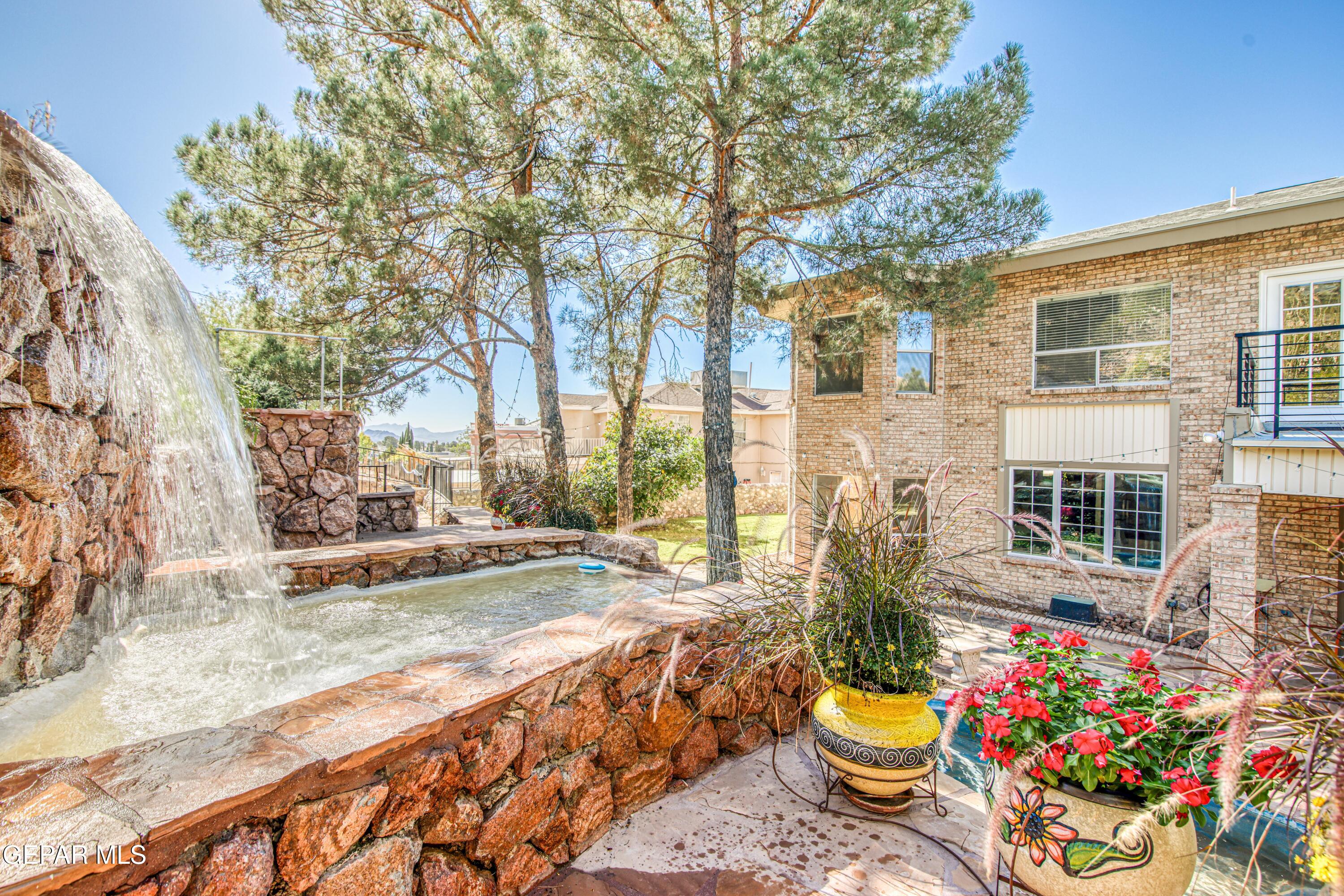 6620 Imperial Ridge Drive El Paso, TX 79912 - Photo 49 of 50 a view of a backyard with sitting area