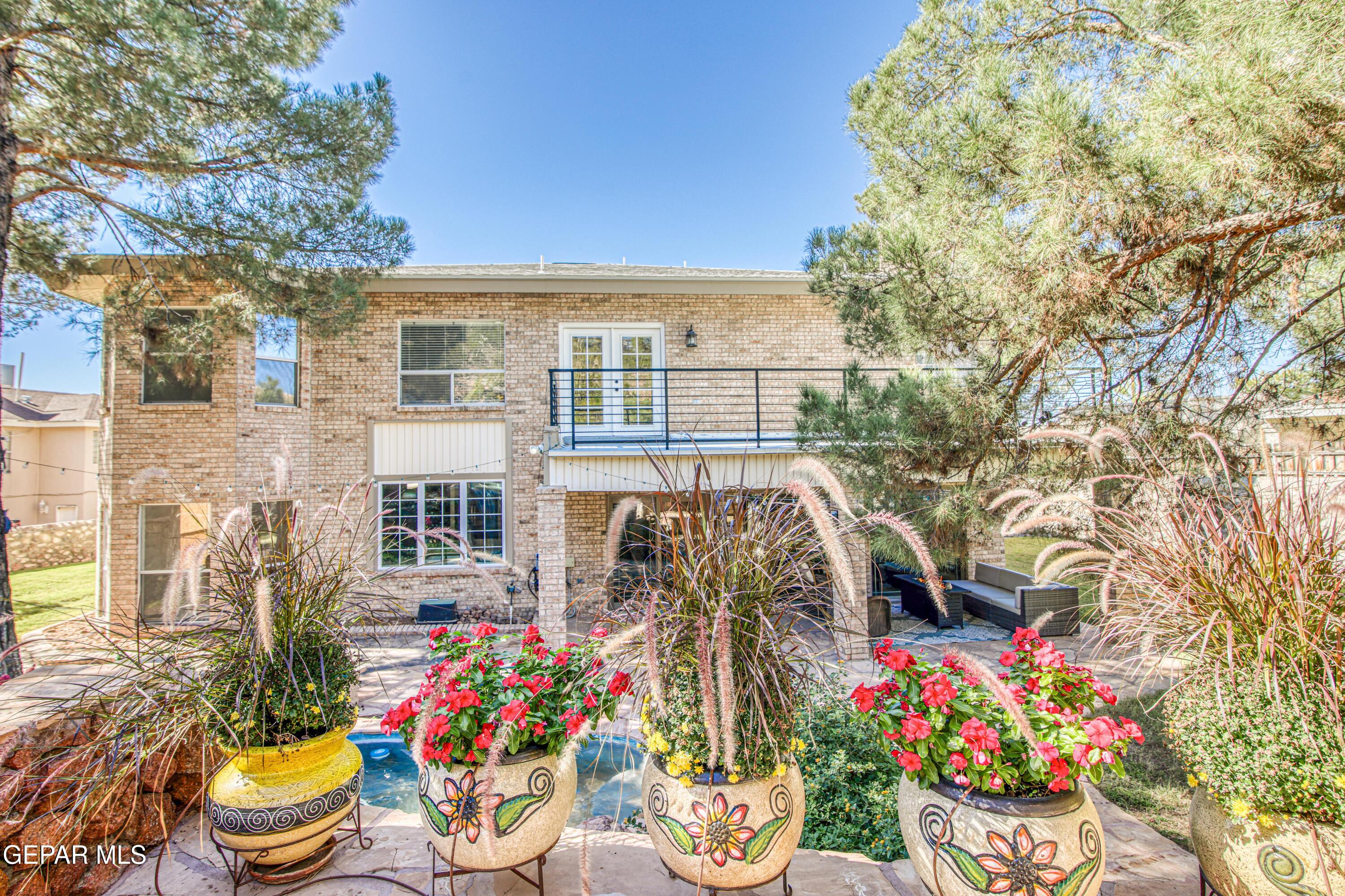 6620 Imperial Ridge Drive El Paso, TX 79912 - Photo 50 of 50 a front view of a house with a yard and fountain
