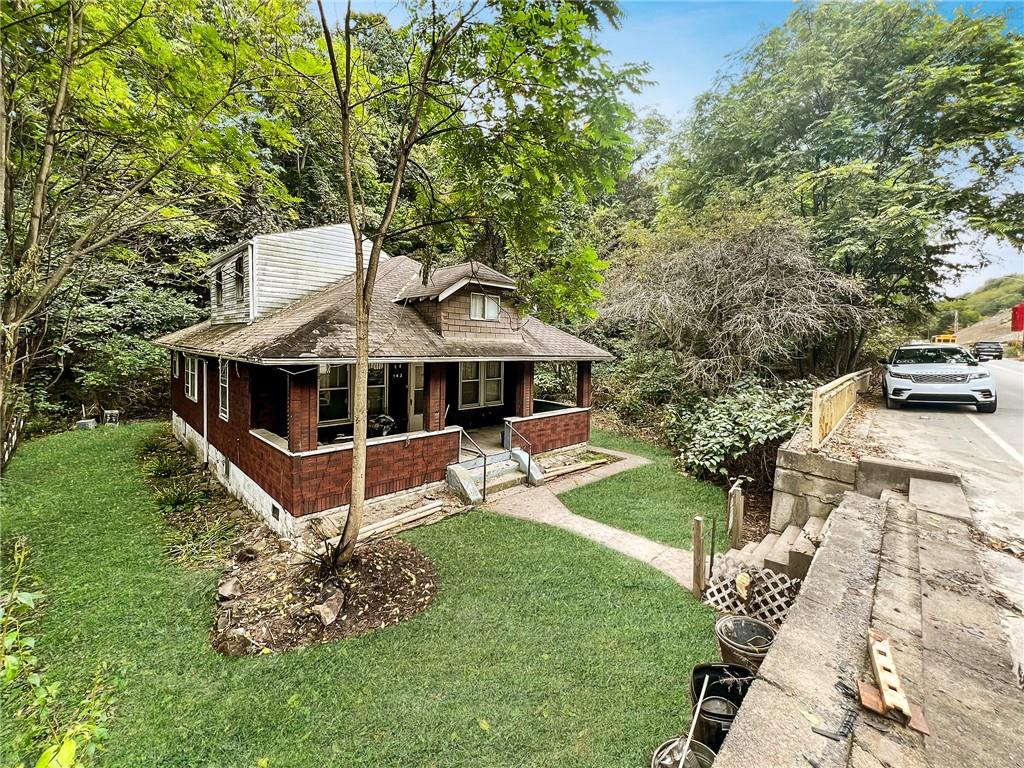 143 Coal Valley Road Clairton, PA 15025 - Photo 1 of 37 a white house with a big yard and large trees