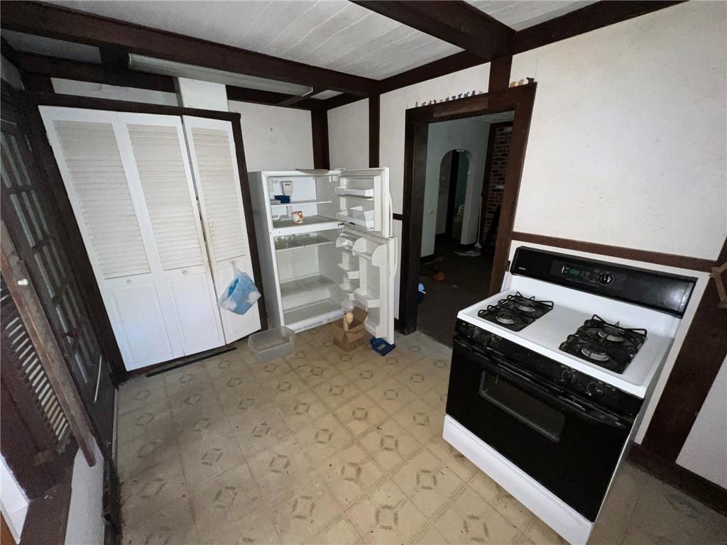 143 Coal Valley Road Clairton, PA 15025 - Photo 14 of 37 a stove top oven sitting inside of a kitchen