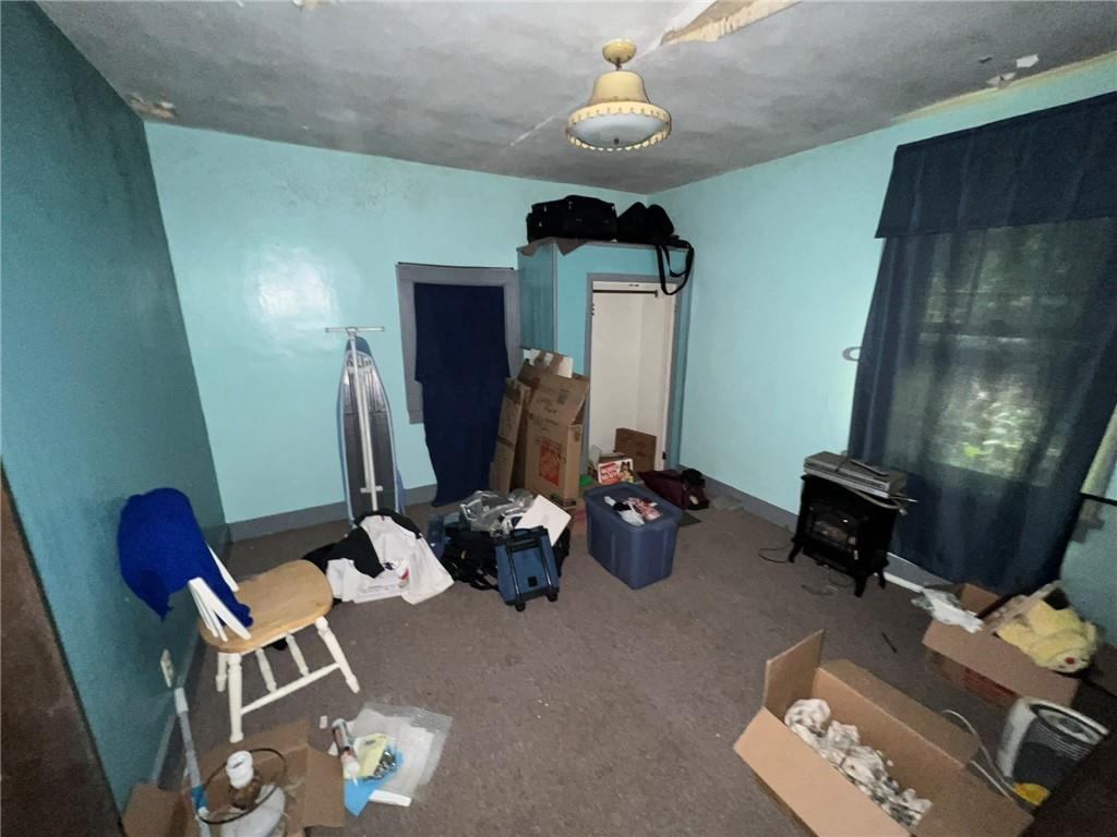 143 Coal Valley Road Clairton, PA 15025 - Photo 18 of 37 a room with furniture and a chandelier