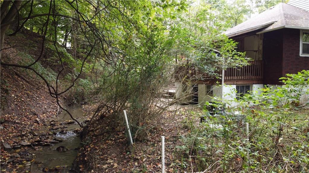 143 Coal Valley Road Clairton, PA 15025 - Photo 27 of 37 a backyard of a house with lots of green space