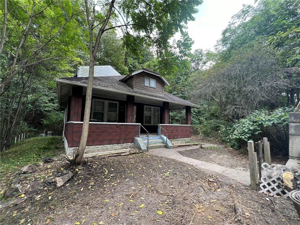 143 Coal Valley Road Clairton, PA 15025 - Photo 3 of 37 a front view of a house with garden