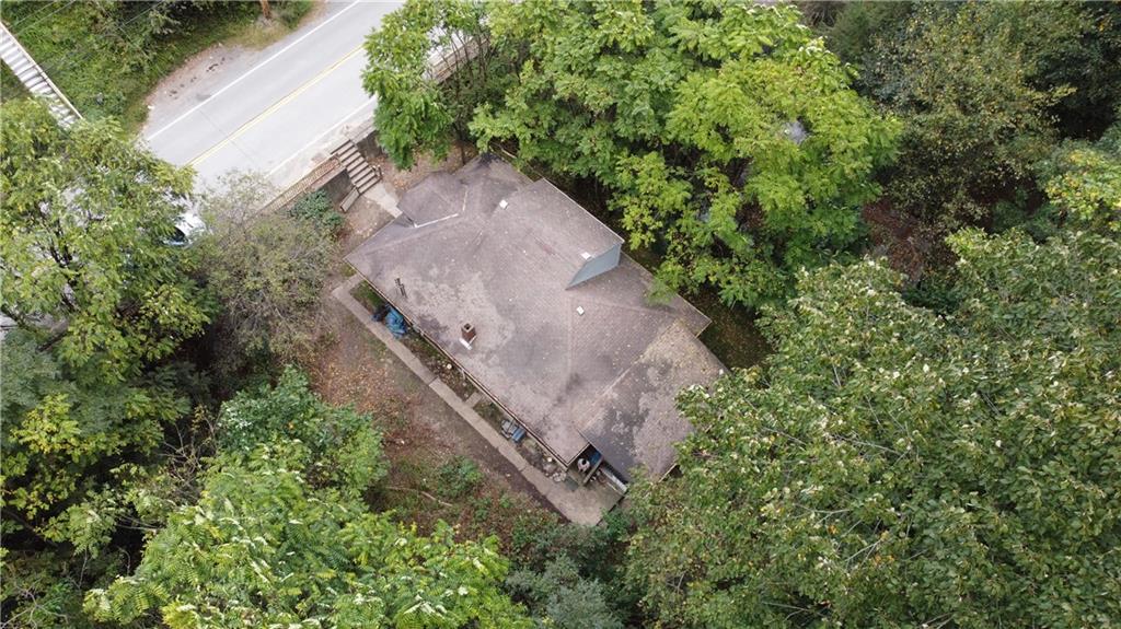 143 Coal Valley Road Clairton, PA 15025 - Photo 32 of 37 an aerial view of a house with a yard and a garage