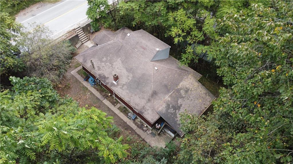143 Coal Valley Road Clairton, PA 15025 - Photo 5 of 37 a view of a backyard with plants and trees