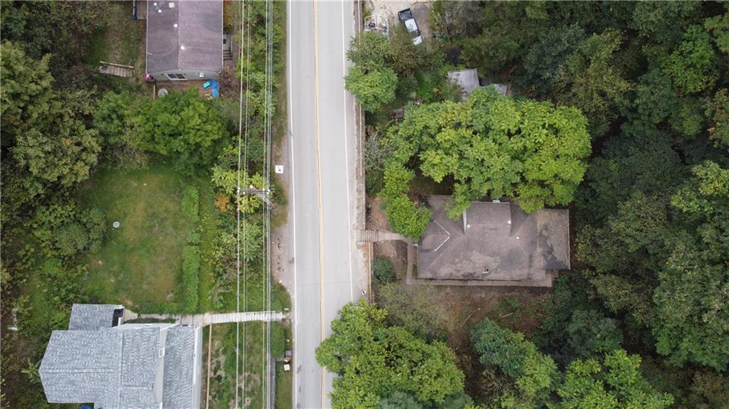 143 Coal Valley Road Clairton, PA 15025 - Photo 7 of 37 an aerial view of a house with a yard and garden