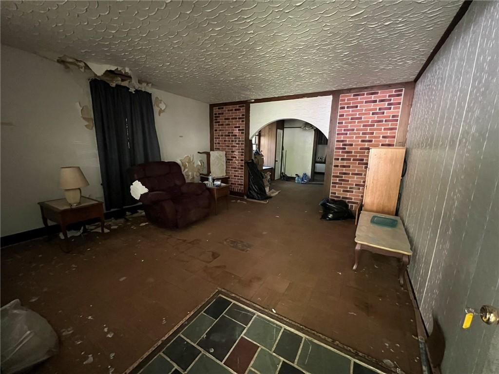 143 Coal Valley Road Clairton, PA 15025 - Photo 9 of 37 a room with gym equipment and a mirror