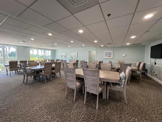 a group of people sitting at tables in a room