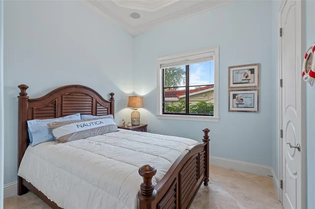 a bedroom with bed and wooden floor