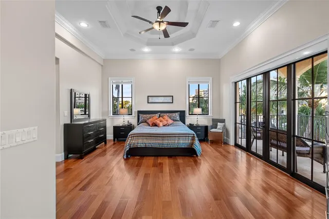 a view of a patio with a table and chairs and floor to ceiling window