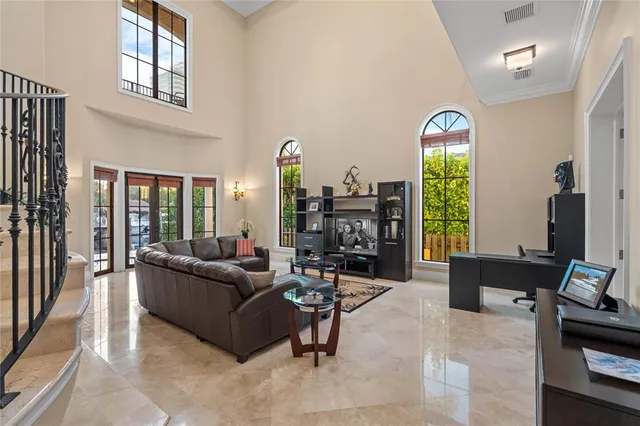 a kitchen with stainless steel appliances granite countertop a sink and a refrigerator