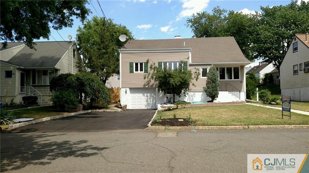 12 Exeter Road Fords, NJ 08863 - Photo 1 of 1 front view of house with a yard and palm trees