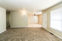5408 31st Street Lubbock, TX 79407 - Photo 6 of 33 a view of a big room with wooden floor and windows