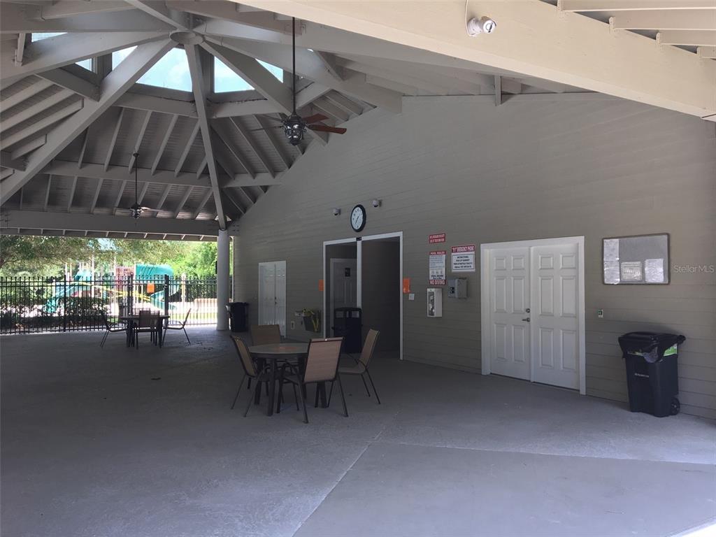8559 Southwest 11th Road Gainesville, FL 32607 - Photo 14 of 19 a view of a patio with table and chairs under an umbrella