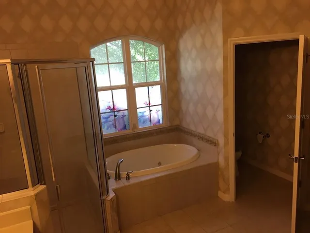 a bath tub sitting next to a window