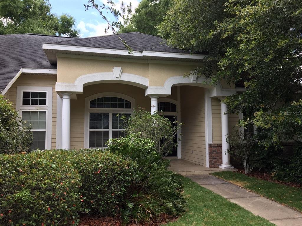 8559 Southwest 11th Road Gainesville, FL 32607 - Photo 7 of 19 a front view of a house with garden
