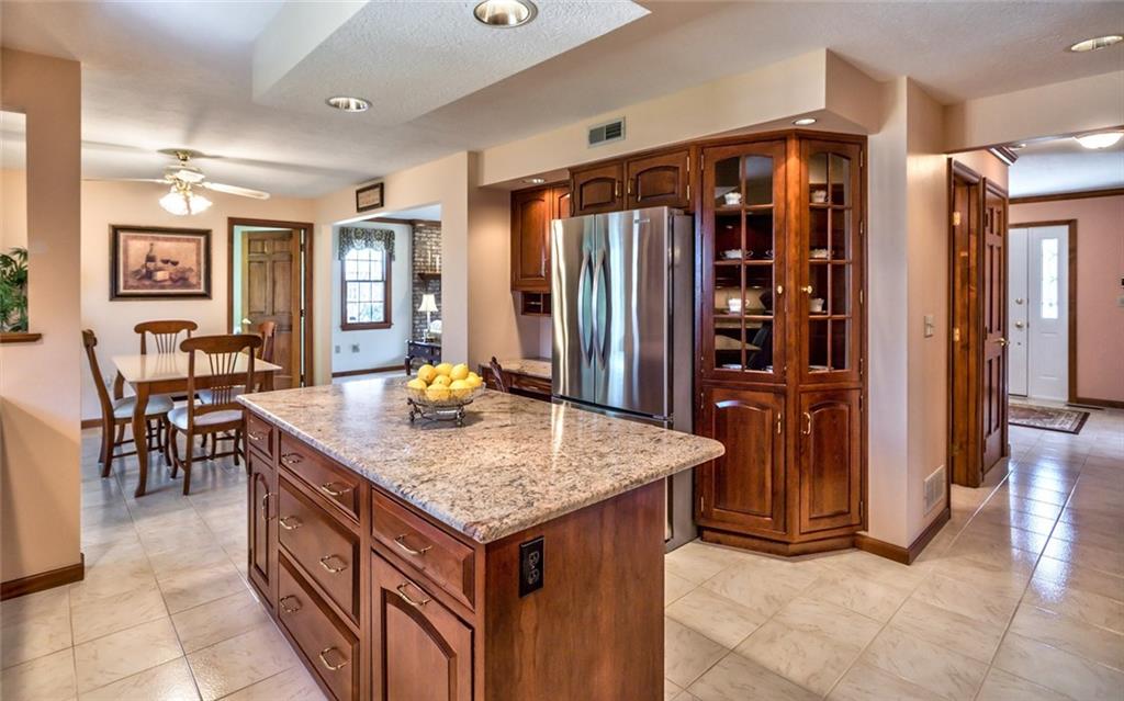 471 Pinkerton Road Wexford, PA 15090 - Photo 12 of 25 Beautifully Renovated Gourmet Granite & Stainless Center Island Kitchen, Island Seating, abundant Custom Cabinetry with Under Cabinet Lighting and Sleek Granite Backsplash