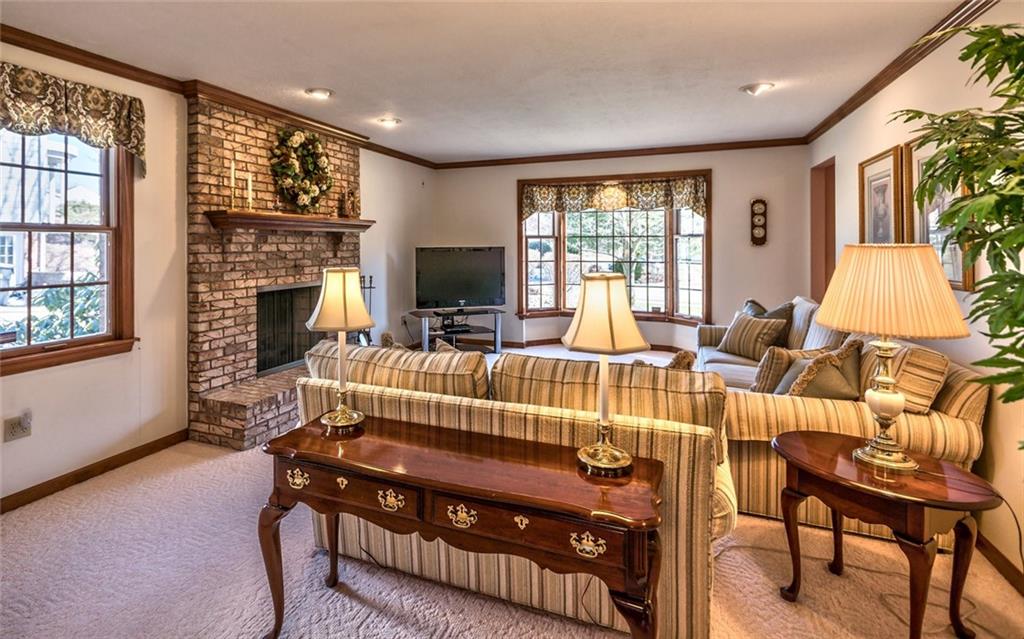471 Pinkerton Road Wexford, PA 15090 - Photo 15 of 25 Spacious Familyroom open to Kitchen with Ceiling-to-Floor Masonry Fireplace & Bayed Window