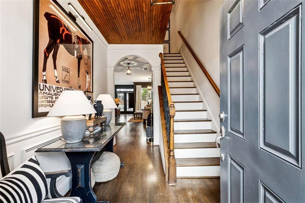 a dining room with furniture and wooden floor