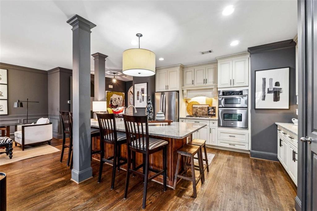 10296 Quadrant Court Alpharetta, GA 30022 - Photo 11 of 28 a view of a dining room with furniture and wooden floor