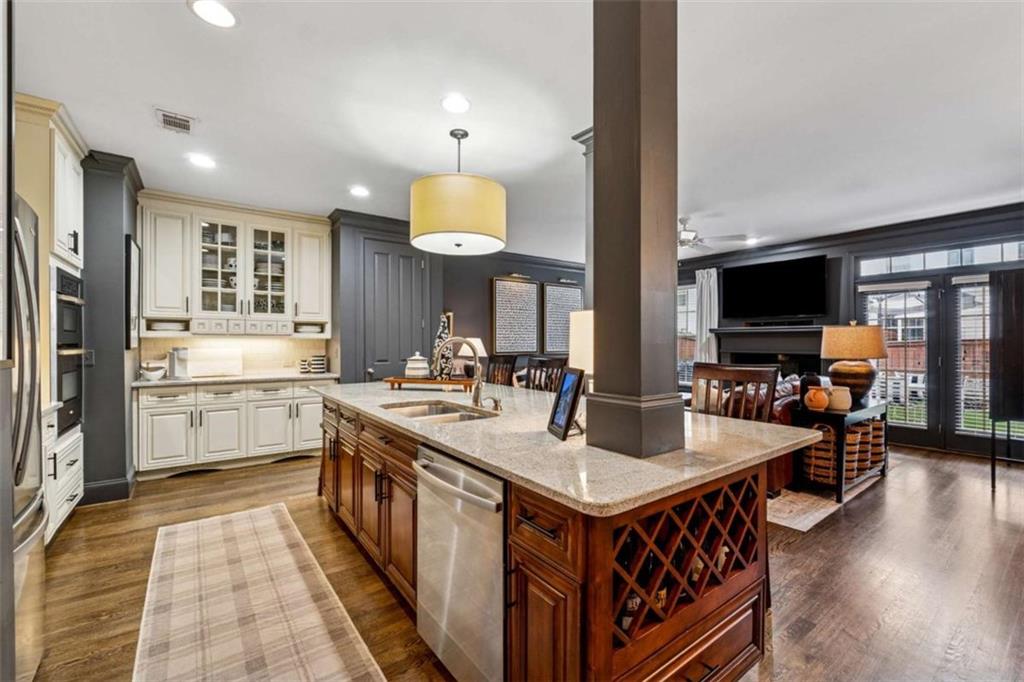 10296 Quadrant Court Alpharetta, GA 30022 - Photo 12 of 28 a kitchen with stainless steel appliances a sink and a refrigerator